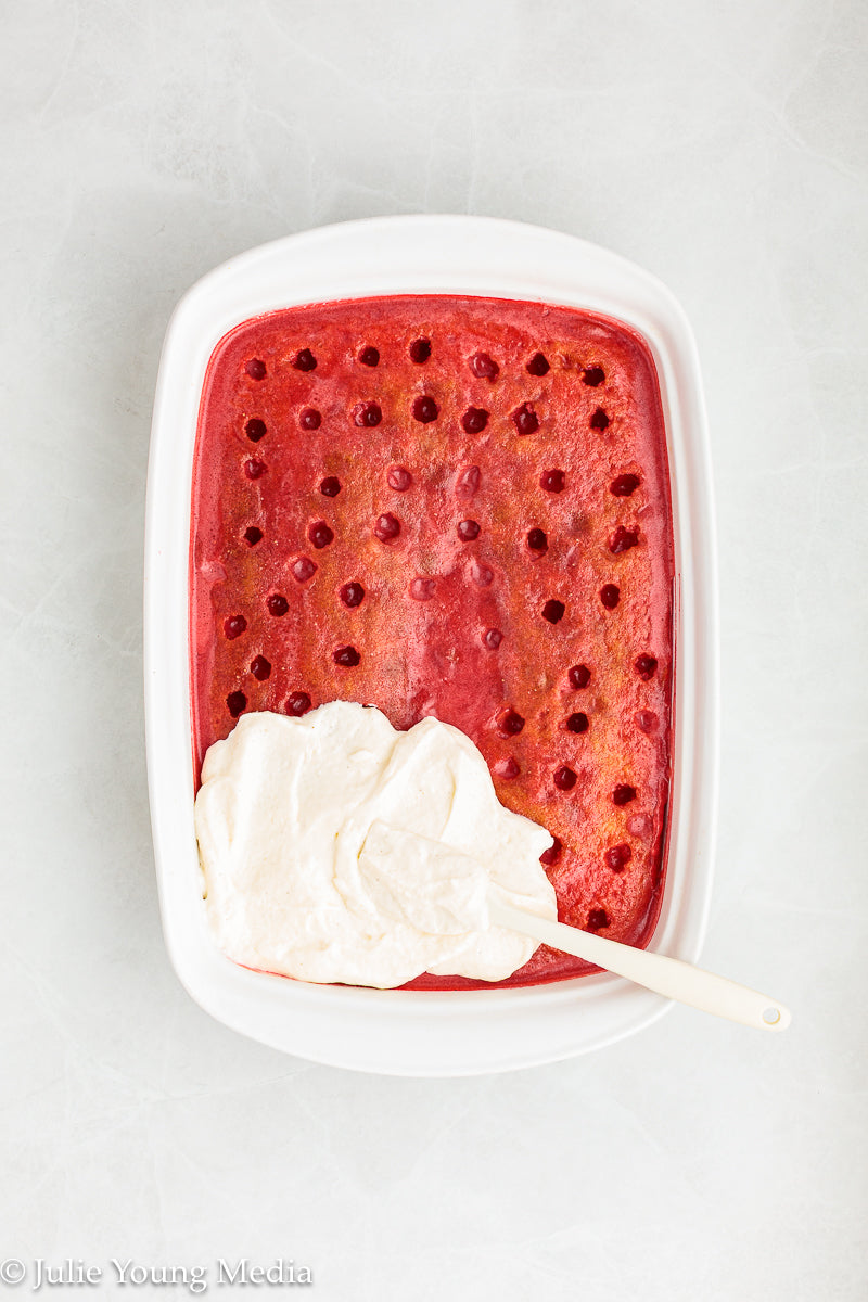 Strawberry Poke Cake with Whipped Vanilla Cream Cheese Frosting