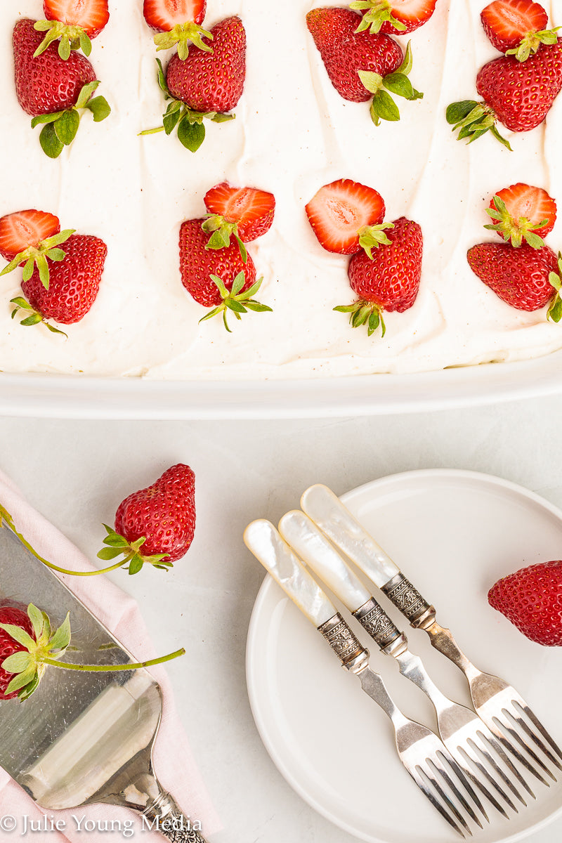 Strawberry Poke Cake with Whipped Vanilla Cream Cheese Frosting