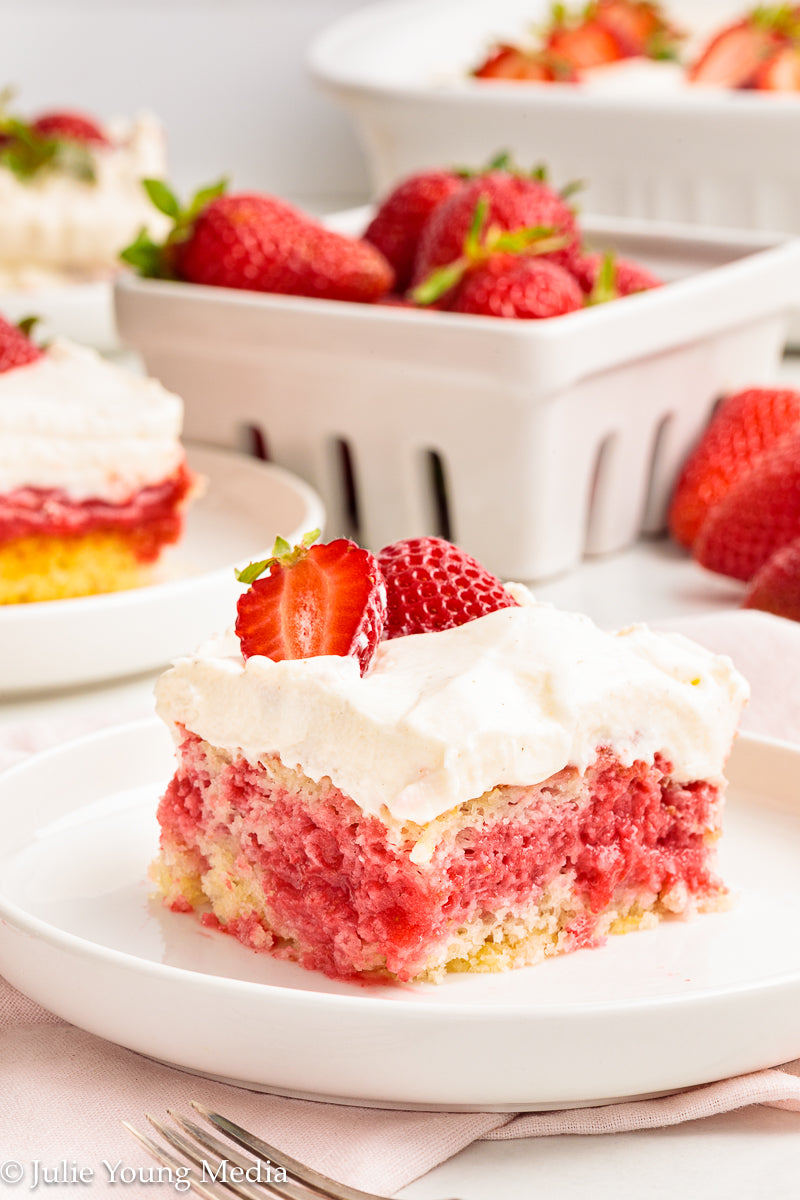 Strawberry Poke Cake with Whipped Vanilla Cream Cheese Frosting