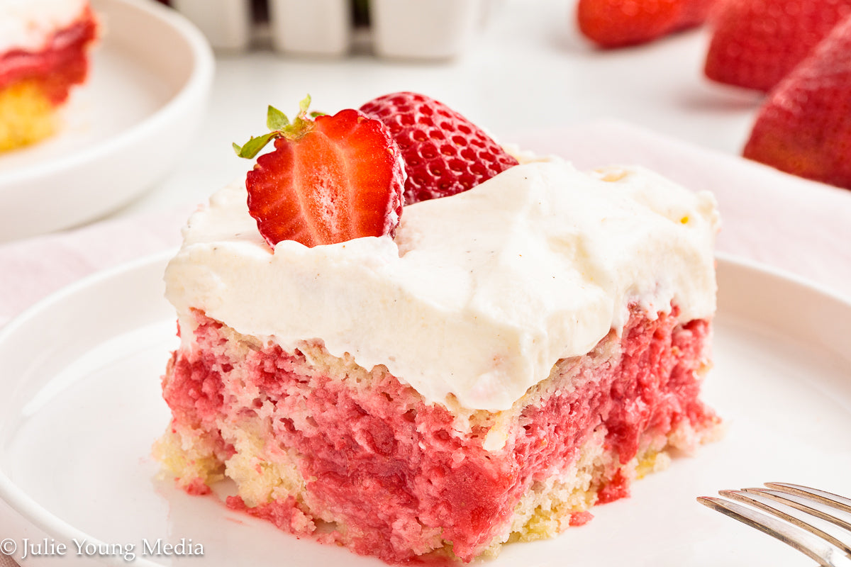 Strawberry Poke Cake with Whipped Vanilla Cream Cheese Frosting