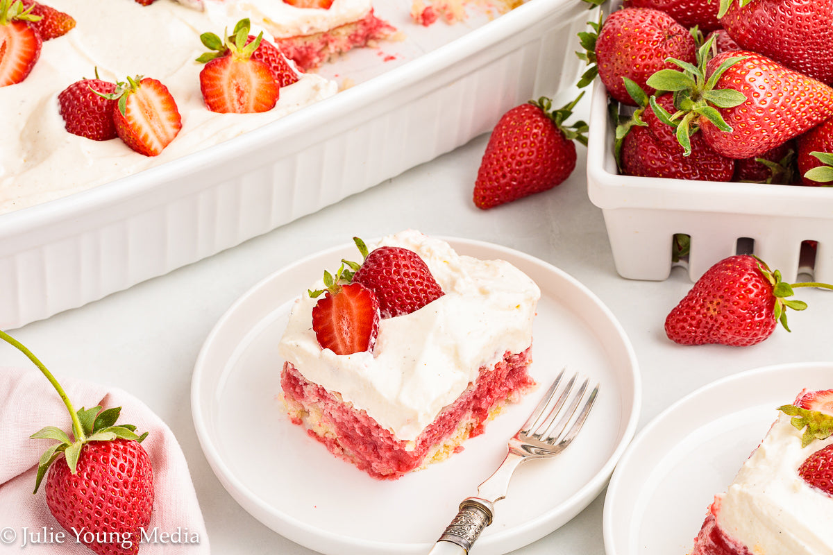 Strawberry Poke Cake with Whipped Vanilla Cream Cheese Frosting