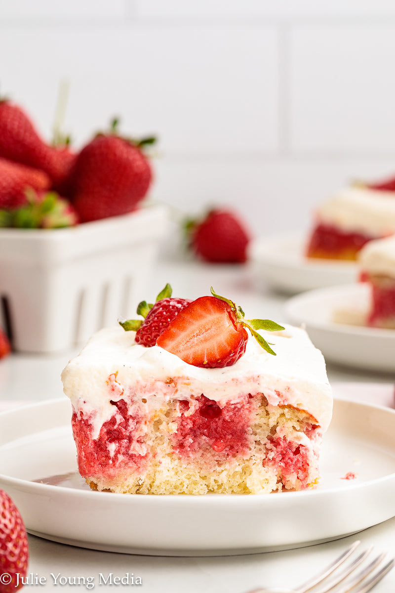 Strawberry Poke Cake with Whipped Vanilla Cream Cheese Frosting