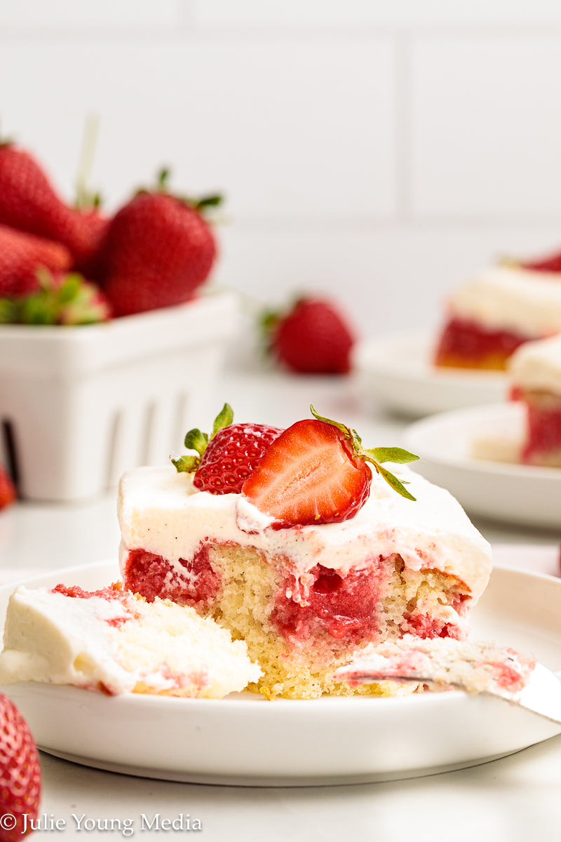 Strawberry Poke Cake with Whipped Vanilla Cream Cheese Frosting