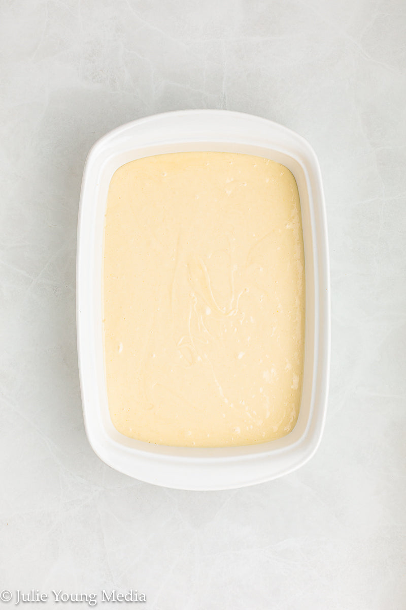 Strawberry Poke Cake with Whipped Vanilla Cream Cheese Frosting